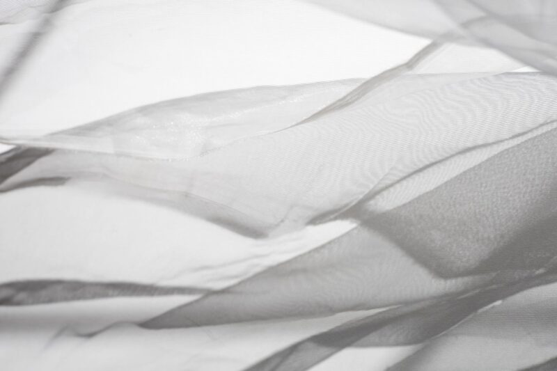 Weiches weißes Textil in Falten