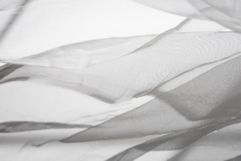 Weiches weißes Textil in Falten
